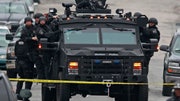 Police are locking down some Boston neighborhoods in Boston and surrounding suburbs as they search for the remaining suspect in the marathon bombings.